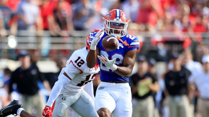 Florida Gators wide receiver Kahleil Jackson (22) hauls in a reception against Georgia Bulldogs defensive back Julian Humphrey (12) during the first quarter of an NCAA Football game Saturday, Oct. 28, 2023 at EverBank Stadium in Jacksonville, Fla. Georgia defeated Florida 43-20. [Corey Perrine/Florida Times-Union]