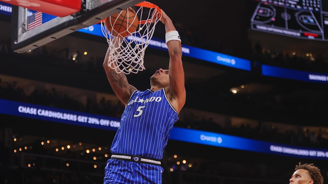 Nov 4, 2025; Atlanta, Georgia, USA; Orlando Magic forward Paolo Banchero (5) dunks against the Atlanta Hawks in the first quarter at State Farm Arena. Mandatory Credit: Brett Davis-Imagn Images