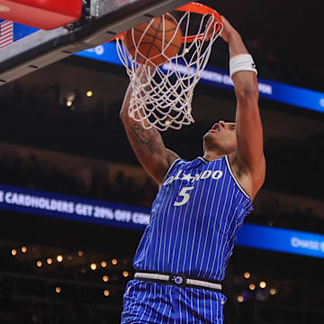 Nov 4, 2025; Atlanta, Georgia, USA; Orlando Magic forward Paolo Banchero (5) dunks against the Atlanta Hawks in the first quarter at State Farm Arena. Mandatory Credit: Brett Davis-Imagn Images