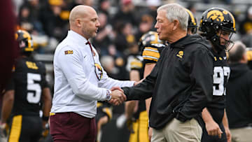 Oct 25, 2025; Iowa City, Iowa, USA; Minnesota Golden Gophers head coach P.J. Fleck (left) shakes hands with Iowa Hawkeyes head coach Kirk Ferentz before the game at Kinnick Stadium. Mandatory Credit: Jeffrey Becker-Imagn Images