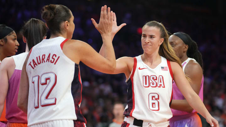 Team USA guard Sabrina Ionescu high-fives teammate Diana Taurasi as they play against Team WNBA in the WNBA All-Star Game