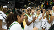 The Oregon women's basketball team celebrates their victory over California Baptist University at Matthew Knight Arena in Eugene Monday, Nov. 4, 2024.