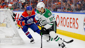 May 27, 2025; Edmonton, Alberta, CAN; Dallas Stars defenseman Thomas Harley (55) skates with the puck past Edmonton Oilers right wing Kasperi Kapanen (42) during the third period in game four of the Western Conference Final of the 2025 Stanley Cup Playoffs at Rogers Place. Mandatory Credit: Perry Nelson-Imagn Images