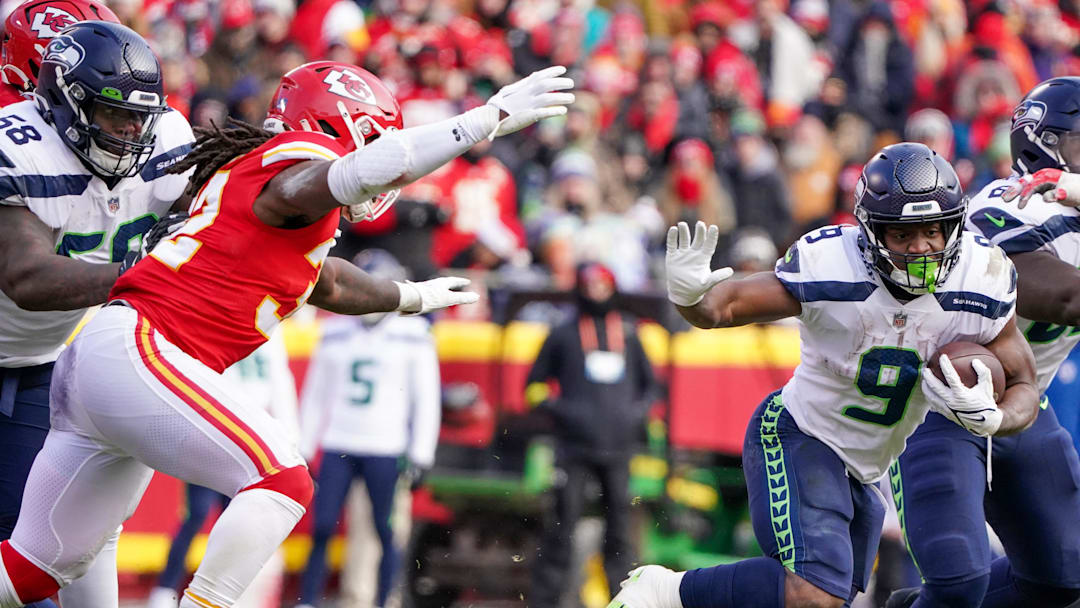 Dec 24, 2022; Kansas City, Missouri, USA; Seattle Seahawks running back Kenneth Walker III (9) runs the ball as Kansas City Chiefs linebacker Nick Bolton (32) defends during the second half at GEHA Field at Arrowhead Stadium. Mandatory Credit: Denny Medley-Imagn Images Dec 24, 2022; Kansas City, Missouri, USA; Seattle Seahawks running back Kenneth Walker III (9) runs the ball as Kansas City Chiefs linebacker Nick Bolton (32) defends during the second half at GEHA Field at Arrowhead Stadium. Mandatory Credit: Denny Medley-Imagn Images