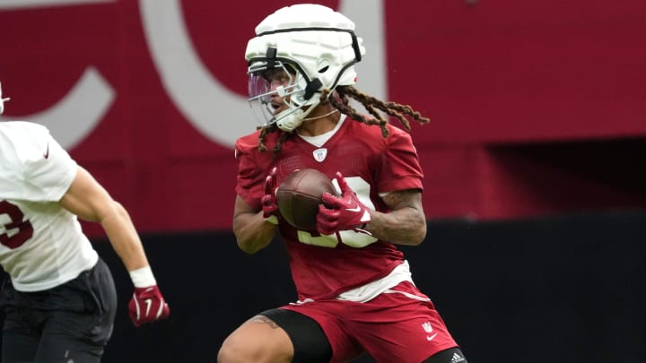 Arizona Cardinals receiver Xavier Weaver (30) catches a pass during training camp at State Farm Stadium in Glendale on July 25, 2024.