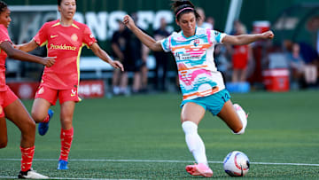 San Diego Wave FC forward Alex Morgan  shoots during Friday's game against Portland