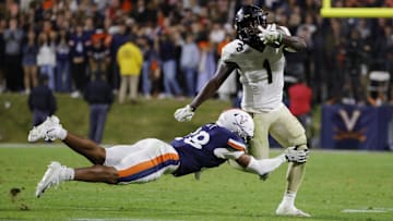 Wake Forest Demon Deacons running back Demond Claiborne (1) carries the ball as Virginia Cavaliers defensive back Donavon Platt (28)