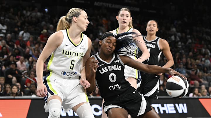 Jun 13, 2025; Las Vegas, Nevada, USA; Las Vegas Aces guard Jackie Young (0) collides with Dallas Wings guard Paige Bueckers (5) in the second quarter of their game at Michelob Ultra Arena. Mandatory Credit: Candice Ward-Imagn Images Jun 13, 2025; Las Vegas, Nevada, USA; Las Vegas Aces guard Jackie Young (0) collides with Dallas Wings guard Paige Bueckers (5) in the second quarter of their game at Michelob Ultra Arena. Mandatory Credit: Candice Ward-Imagn Images