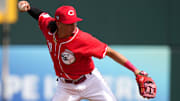 Cincinnati Reds shortstop Edwin Arroyo throws to first base in the third inning during a MLB spring training baseball game, Sunday, Feb. 25, 2024, at Goodyear Ballpark in Goodyear, Ariz.