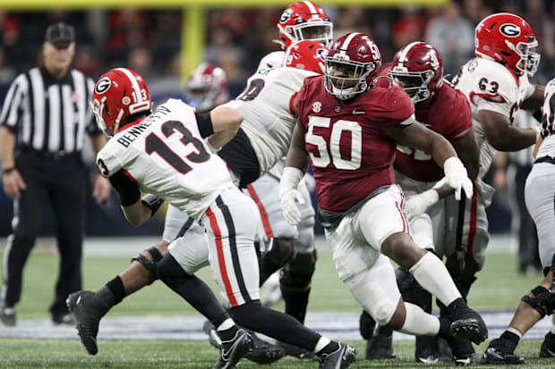 Alabama Crimson Tide defensive lineman Tim Smith (50) pressures Georgia Bulldogs quarterback Stetson Bennett (13).