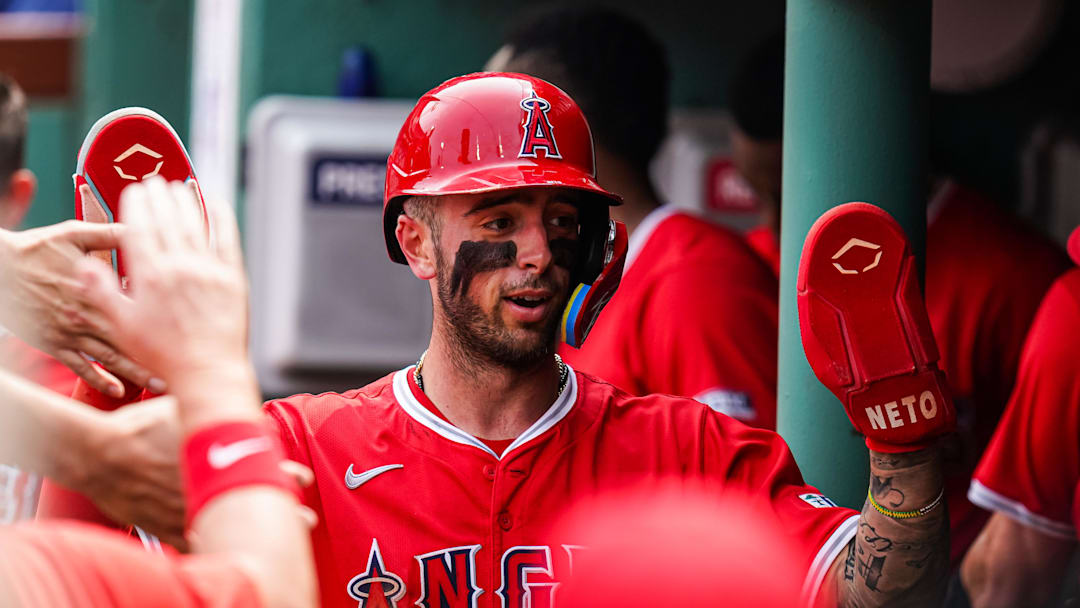 Jun 4, 2025; Boston, Massachusetts, USA; Los Angeles Angels shortstop Zach Neto (9) is congratulated after scoring against the Boston Red Sox in the second inning at Fenway Park. Mandatory Credit: David Butler II-Imagn Images