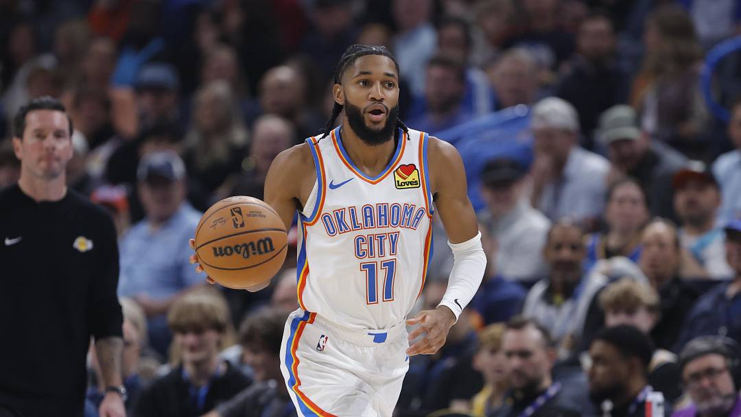 Nov 12, 2025; Oklahoma City, Oklahoma, USA; Oklahoma City Thunder guard Isaiah Joe (11) dribbles down the court against the Los Angeles Lakers during the second quarter at Paycom Center. Mandatory Credit: Alonzo Adams-Imagn Images