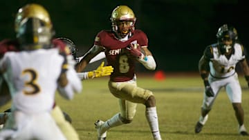 Florida High junior Micahi Danzy (8) rushes the ball toward the end zone in the Class 2S state semifinal matchup between Florida High and Bishop Verot on Dec. 2, 2022, at Mike Hickman Stadium. The Seminoles won, 38-28.

J9t8652