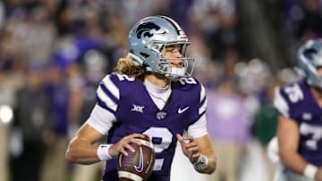 Oct 26, 2024; Manhattan, Kansas, USA; Kansas State Wildcats quarterback Avery Johnson (2) drops back to pass during the third quarter against the Kansas Jayhawks at Bill Snyder Family Football Stadium. Mandatory Credit: Scott Sewell-Imagn Images