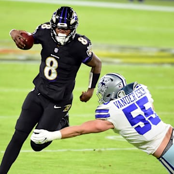 Dec 8, 2020; Baltimore, Maryland, USA; Baltimore Ravens quarterback Lamar Jackson (8) avoids the tackle of Dallas Cowboys linebacker Leighton Vander Esch (55) in the third quarter at M&T Bank Stadium. Mandatory Credit: Evan Habeeb-Imagn Images