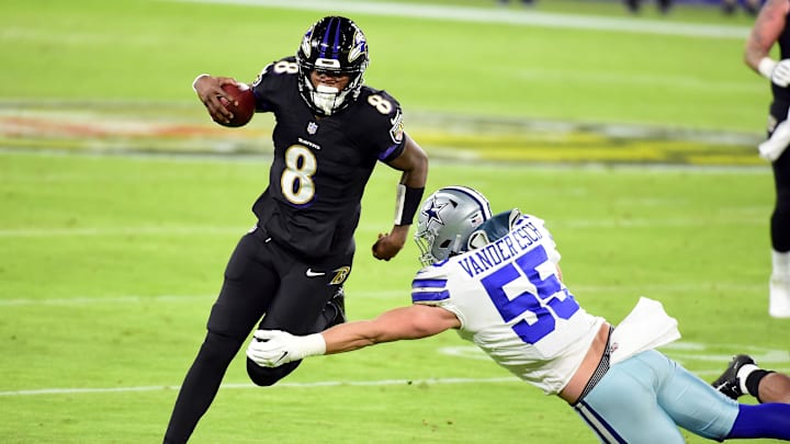 Dec 8, 2020; Baltimore, Maryland, USA; Baltimore Ravens quarterback Lamar Jackson (8) avoids the tackle of Dallas Cowboys linebacker Leighton Vander Esch (55) in the third quarter at M&T Bank Stadium. Mandatory Credit: Evan Habeeb-Imagn Images