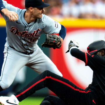 Detroit Tigers shortstop Ryan Kreidler (32) turns a double play as Cincinnati Reds shortstop Elly De La Cruz (44) slides into second in the fourth inning of the MLB game between the Cincinnati Reds and the Detroit Tigers at Great American Ball Park in Cincinnati on Friday, July 5, 2024.