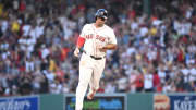 Boston Red Sox third baseman Rafael Devers (11) runs the bases after hitting a two-run home run against the Seattle Mariners during the third inning at Fenway Park on July 30.