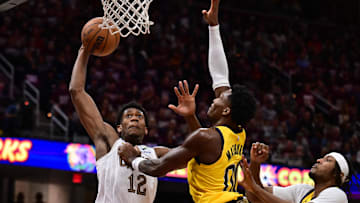 May 4, 2025; Cleveland, Ohio, USA; Cleveland Cavaliers forward De'Andre Hunter (12) drives to the basket against Indiana Pacers guard Bennedict Mathurin (00) during the second half in game one of the second round for the 2025 NBA Playoffs at Rocket Arena. Mandatory Credit: Ken Blaze-Imagn Images