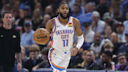 Nov 12, 2025; Oklahoma City, Oklahoma, USA; Oklahoma City Thunder guard Isaiah Joe (11) dribbles down the court against the Los Angeles Lakers during the second quarter at Paycom Center.