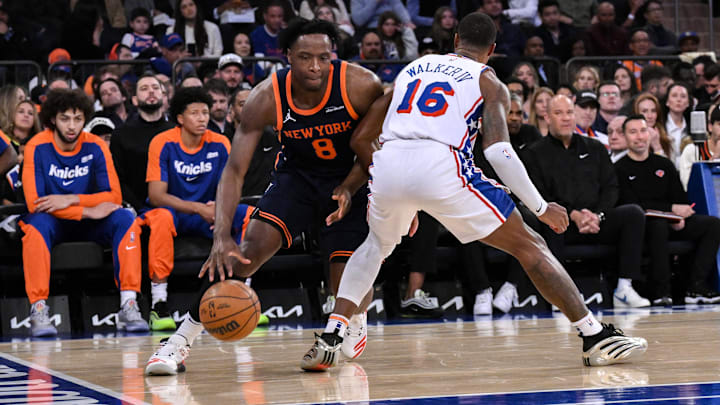 Apr 1, 2025; New York, New York, USA; New York Knicks forward OG Anunoby (8) drives to the basket while being defended by Philadelphia 76ers guard Lonnie Walker IV (16) during the first half at Madison Square Garden. Mandatory Credit: John Jones-Imagn Images