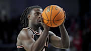 Feb 21, 2024; Cincinnati, Ohio, USA;  Oklahoma State Cowboys guard Jamyron Keller (14) attempts a free throw against the Cincinnati Bearcats in the second half at Fifth Third Arena. Mandatory Credit: Aaron Doster-Imagn Images