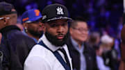 Apr 6, 2025; New York, New York, USA; NFL wide receiver Odell Beckham Jr. sits courtside during the second half of the NBA game between the New York Knicks and the Phoenix Suns at Madison Square Garden.  