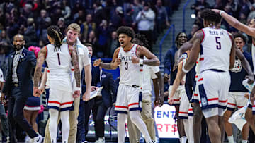 Jan 29, 2025; Hartford, Connecticut, USA; UConn Huskies guard Solo Ball (1) and forward Liam McNeeley (30) react after a play against the DePaul Blue Demons in the second half at XL Center. Mandatory Credit: David Butler II-Imagn Images