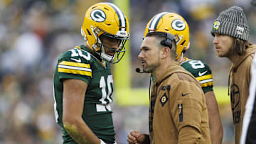 Nov 5, 2023; Green Bay, Wisconsin, USA;  Green Bay Packers head coach Matt LaFleur talks with quarterback Jordan Love (10) during the second quarter against the Los Angeles Rams at Lambeau Field. Mandatory Credit: Jeff Hanisch-Imagn Images