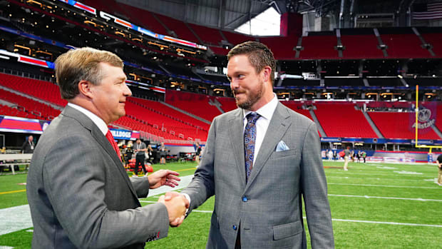 Georgia Bulldogs head coach Kirby Smart greets Oregon Ducks head coach Dan Lanning midfield 