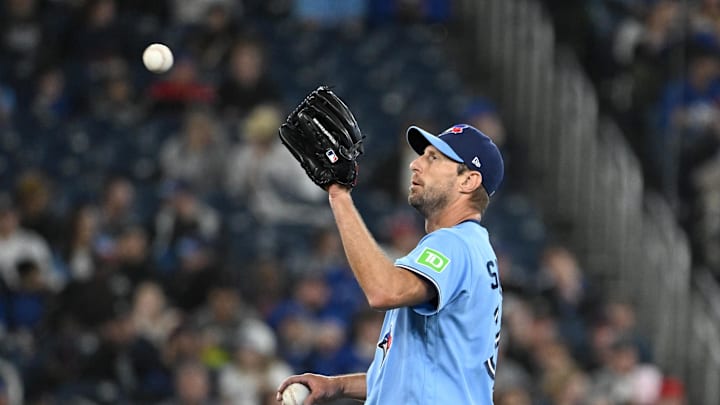 Mar 31, 2026; Toronto, Ontario, CAN;  Toronto Blue Jays starting pitcher Max Scherzer (31) receives a new ball in the fourth inning against the Colorado Rockies at Rogers Centre. Mandatory Credit: Dan Hamilton-Imagn Images