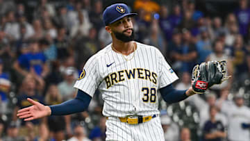 Jul 28, 2024; Milwaukee, Wisconsin, USA; Milwaukee Brewers relief pitch Devin Williams (38) reacts after pitching in the ninth inning against the Miami Marlins in his first game back from the injured list this year at American Family Field. Mandatory Credit: Benny Sieu-Imagn Images