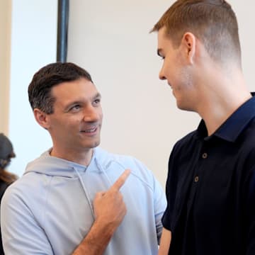 Thunder head coach Mark Daigneault talks with Nikola Topic during an introductory press conference for the 2024 Thunder draft picks at Oklahoma Contemporary Arts Center in Oklahoma City, Saturday, June, 29, 2024.