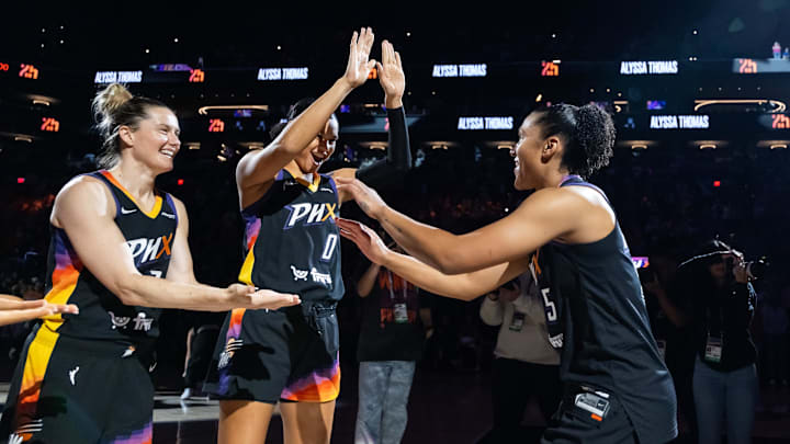 Jun 11, 2025; Phoenix, Arizona, USA; Phoenix Mercury forward Alyssa Thomas (25) with forward Satou Sabally (0) and guard Sami Whitcomb (33) against the Dallas Wings at PHX Arena. Mandatory Credit: Mark J. Rebilas-Imagn Images