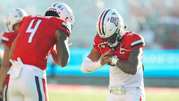 Oct 26, 2024; Tucson, Arizona, USA; Arizona Wildcats quarterback Noah Fifita (11) does handshake with Arizona Wildcats wide receiver Tetairoa McMillan (4) before the game against West Virginia Mountaineers at Arizona Stadium. Mandatory Credit: Aryanna Frank-Imagn Images