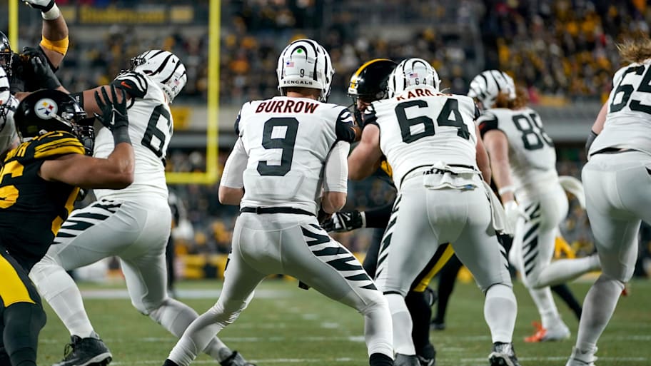 Nov 20, 2022, Pittsburgh, Pennsylvania, USA; Cincinnati Bengals quarterback Joe Burrow (9) moves in the pocket as the offensive line blocks in the second quarter against the Pittsburgh Steelers at Acrisure Stadium. Mandatory Credit: Kareem Elgazzar/The Enquirer-Imagn Images | Kareem Elgazzar/The Enquirer