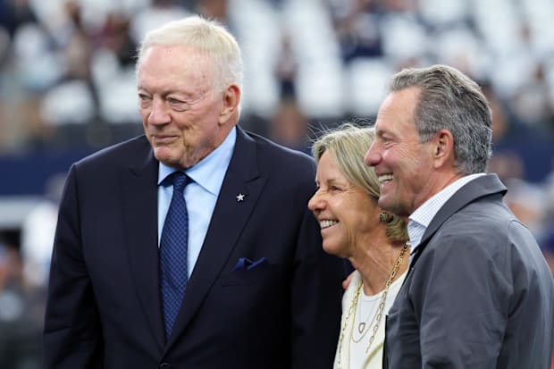 Dallas Cowboys owner Jerry Jones (left) takes a photo with Detroit Lions owner Sheila Ford Hamp and her husband Steve