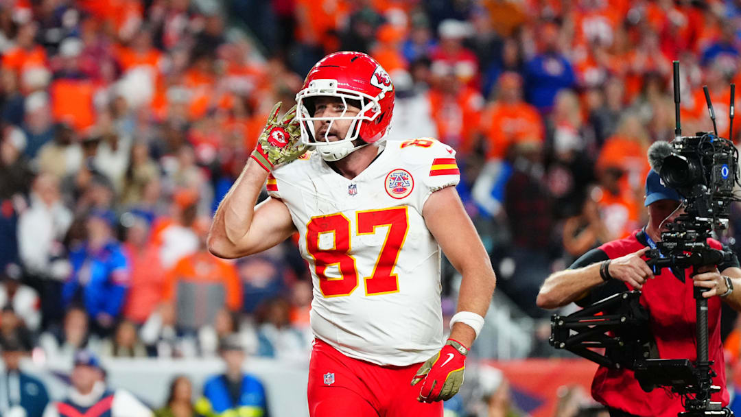 Nov 16, 2025; Denver, Colorado, USA; Kansas City Chiefs tight end Travis Kelce (87) reacts after his touchdown in the fourth quarter against the Denver Broncos at Empower Field at Mile High. Mandatory Credit: Ron Chenoy-Imagn Images