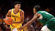 Nov 18, 2025; Minneapolis, Minnesota, USA; Minnesota Golden Gophers guard Isaac Asuma (1) controls the ball as Chicago State Cougars guard Marcus Tankersley (4) defends during the first half at Williams Arena. Mandatory Credit: Matt Krohn-Imagn Images