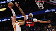 Nov 25, 2025; Washington, District of Columbia, USA; Atlanta Hawks guard Luke Kennard (3) shoots the ball as Washington Wizards guard Bilal Coulibaly (0) defends in the first half at Capital One Arena. Mandatory Credit: Geoff Burke-Imagn Images