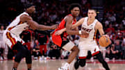 Dec 29, 2024; Houston, Texas, USA; Miami Heat guard Tyler Herro (14) handles the ball against Houston Rockets guard Amen Thompson (1) during the fourth quarter at Toyota Center. Mandatory Credit: Erik Williams-Imagn Images
