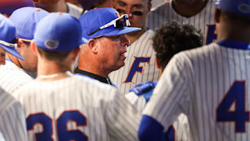 Gator Baseball Coach Kevin O'Sullivan huddles with his team during a game this season. 