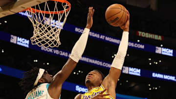 Feb 19, 2025; Los Angeles, California, USA; Los Angeles Lakers forward Rui Hachimura (28) shoots against Charlotte Hornets center Mark Williams (5) during the first quarter at Crypto.com Arena. Mandatory Credit: Jason Parkhurst-Imagn Images