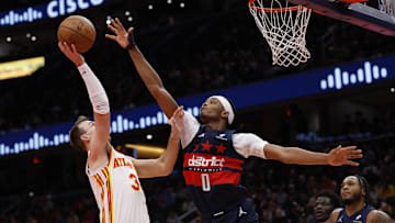 Nov 25, 2025; Washington, District of Columbia, USA; Atlanta Hawks guard Luke Kennard (3) shoots the ball as Washington Wizards guard Bilal Coulibaly (0) defends in the first half at Capital One Arena. Mandatory Credit: Geoff Burke-Imagn Images