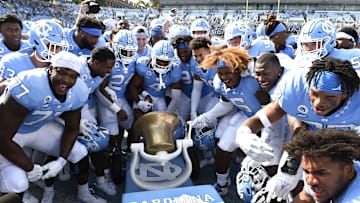 Oct 2, 2021; Chapel Hill, North Carolina, USA; North Carolina Tar Heels players celebrate after winning the game and the Victory Bell at Kenan Memorial Stadium. 