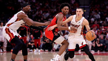 Dec 29, 2024; Houston, Texas, USA; Miami Heat guard Tyler Herro (14) handles the ball against Houston Rockets guard Amen Thompson (1) during the fourth quarter at Toyota Center. Mandatory Credit: Erik Williams-Imagn Images
