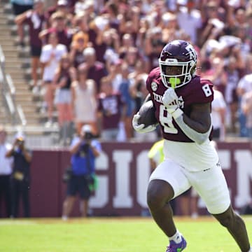 Sep 7, 2024; College Station, Texas, USA; Texas A&M Aggies running back Le'Veon Moss (8) runs the ball during the first quarter against the McNeese State Cowboys at Kyle Field. Mandatory Credit: Dustin Safranek-Imagn Images