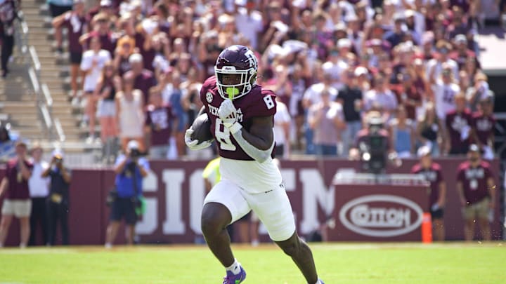 Sep 7, 2024; College Station, Texas, USA; Texas A&M Aggies running back Le'Veon Moss (8) runs the ball during the first quarter against the McNeese State Cowboys at Kyle Field. Mandatory Credit: Dustin Safranek-Imagn Images