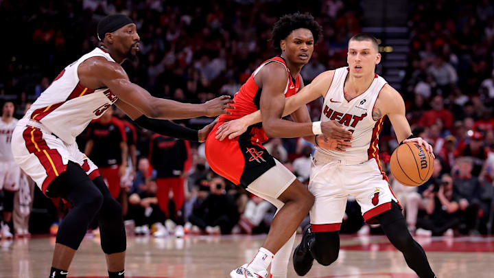 Dec 29, 2024; Houston, Texas, USA; Miami Heat guard Tyler Herro (14) handles the ball against Houston Rockets guard Amen Thompson (1) during the fourth quarter at Toyota Center. Mandatory Credit: Erik Williams-Imagn Images
Dec 29, 2024; Houston, Texas, USA; Miami Heat guard Tyler Herro (14) handles the ball against Houston Rockets guard Amen Thompson (1) during the fourth quarter at Toyota Center. Mandatory Credit: Erik Williams-Imagn Images