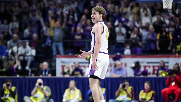 Lyon County's Travis Perry (11) reacts after making a three-point shot against Harlan County Saturday at the 2024 UK Healthcare KHSAA Boys' Sweet 16 Championship at Rupp Arena in Lexington,Ky. March 23, 2024